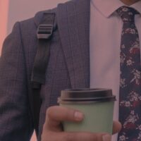 B2B marketing professional reviewing data strategy in a server room environment, representing Digital C4's approach to personalized content and lead generation