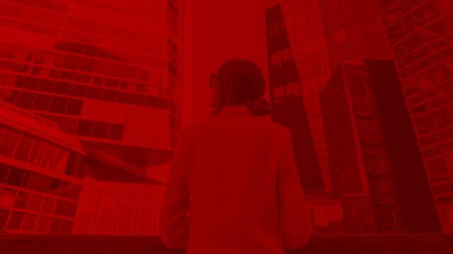 B2B marketing professional reviewing data strategy in a server room environment, representing Digital C4's approach to personalized content and lead generation